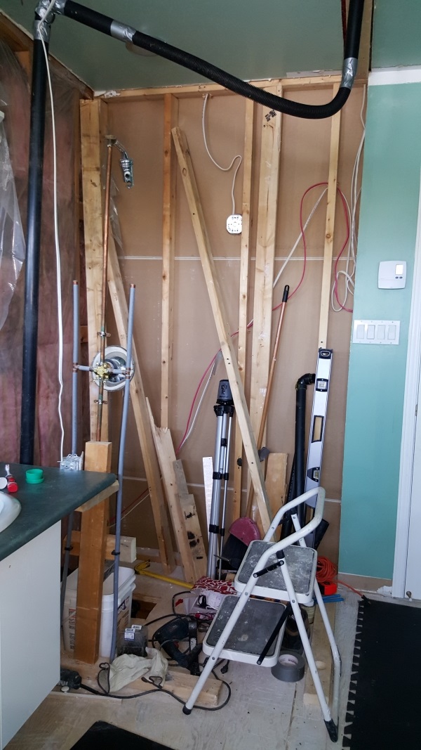 Finishing shower demolition work, displacing the plumbing vent pipe